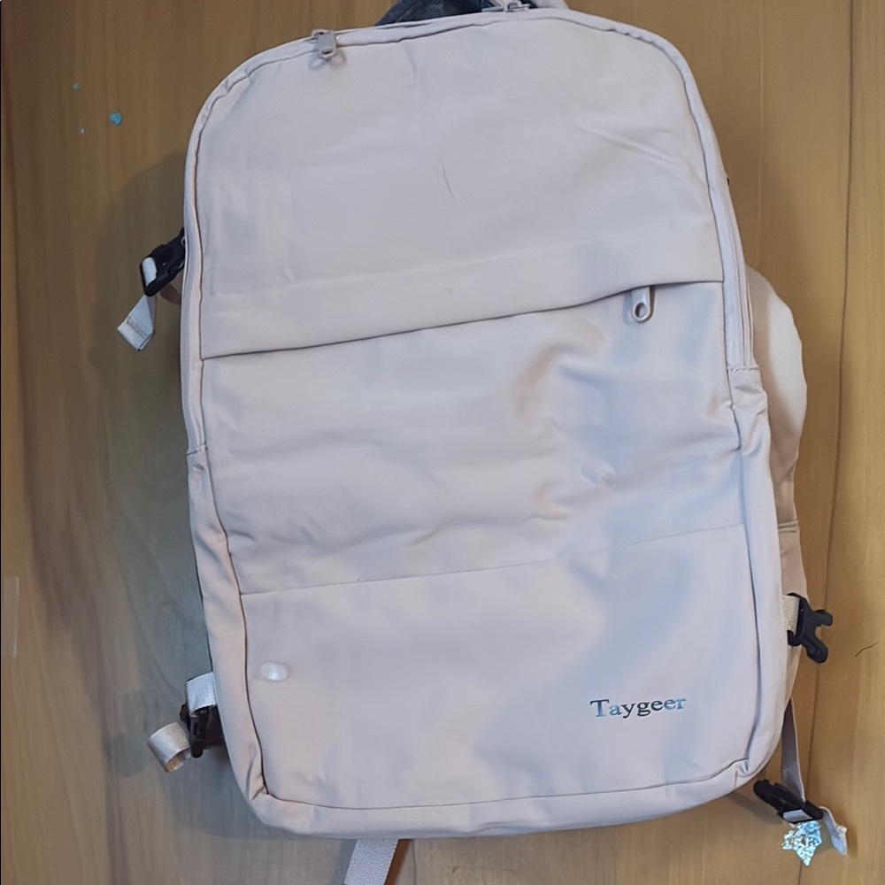 Cream Backpack with Sleek Design and Versatile Functionality